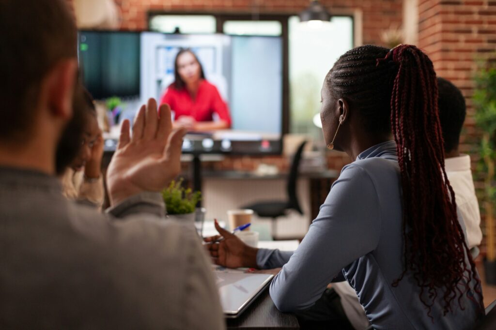 Multi-ethnic people discussing financial strategy with remote collegue